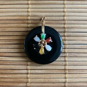 Elegant Black Pendant with Multicolor Floral Design